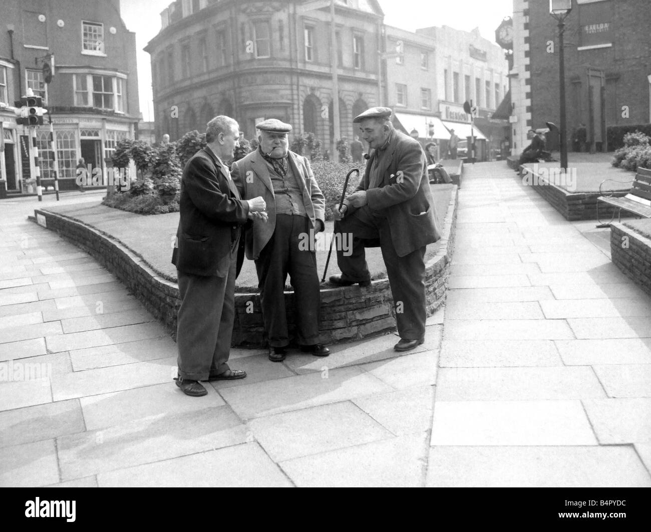 Three old men putting the world to right in the town centre of Stourbridge glass negs taken 1958 Stock Photo