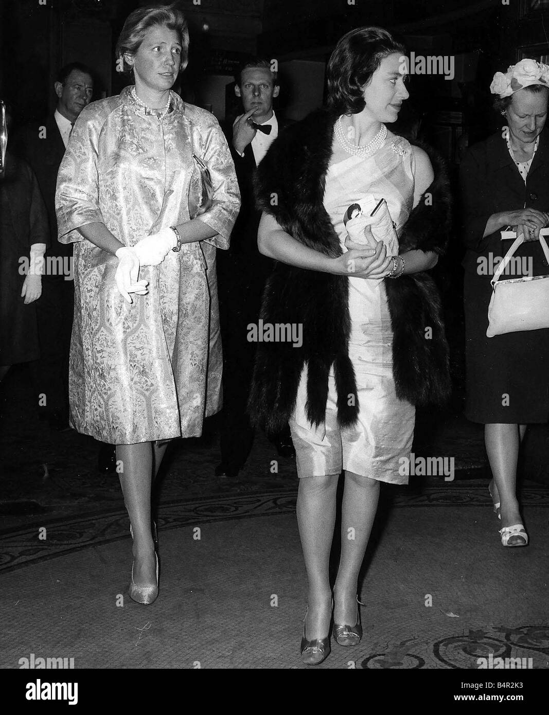 Princess Margaret June 1962 followed by Sharman Douglas who accompanied them to the theatre Stock Photo