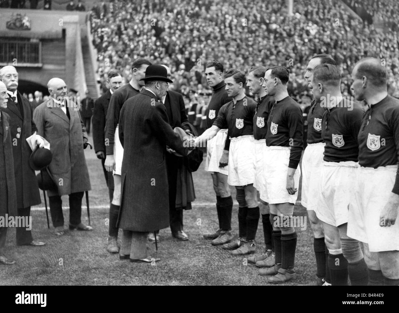 Sport Fooball Arsenal King George V is introduced to the Arsenal team by captain Charles Buchan before the FA Cup final game aga Stock Photo