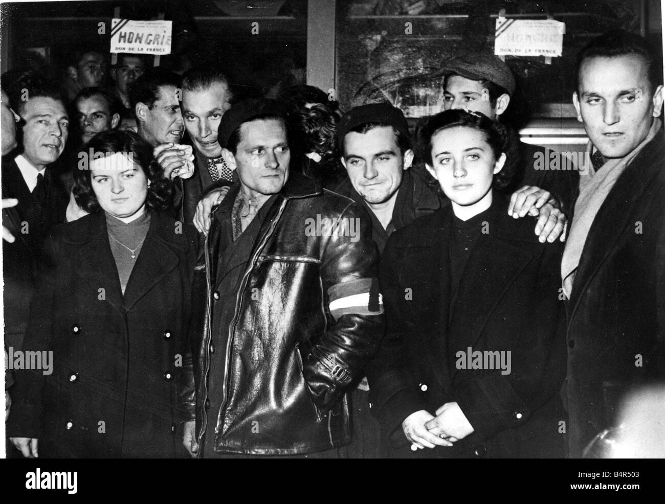 Hungary Hungarian refugees in Paris A party of refugees showing expressions of the suffering they endured before escaping to Vienna when they arrived at the Gare D Orsay Paris which has now been transformed into a reception centre 10th Nov 1956 Stock Photo