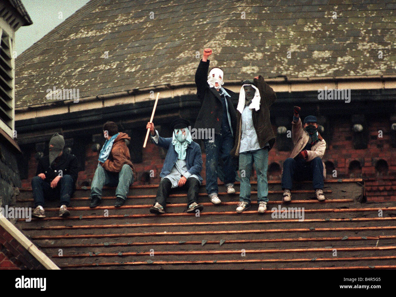 Rooftop protest by prisoners at Strangeways Prison 1990 in Machester The slates have been stripped from the roof and thrown to the ground below Stock Photo