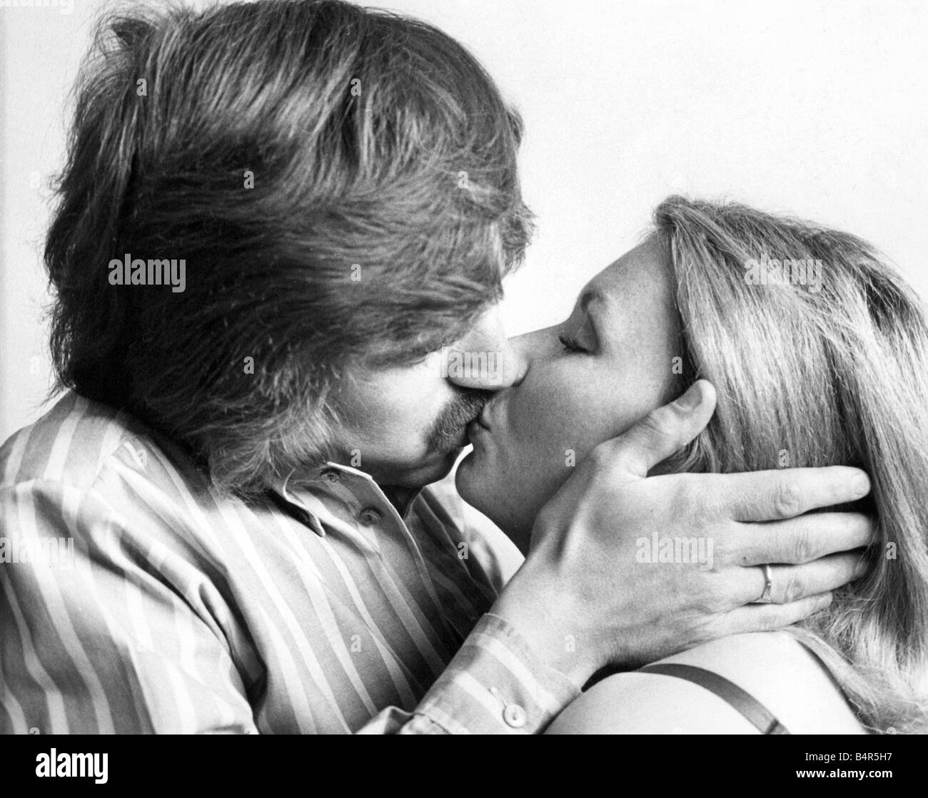 1970s couple kissing Black and White Stock Photos and Images picture pic