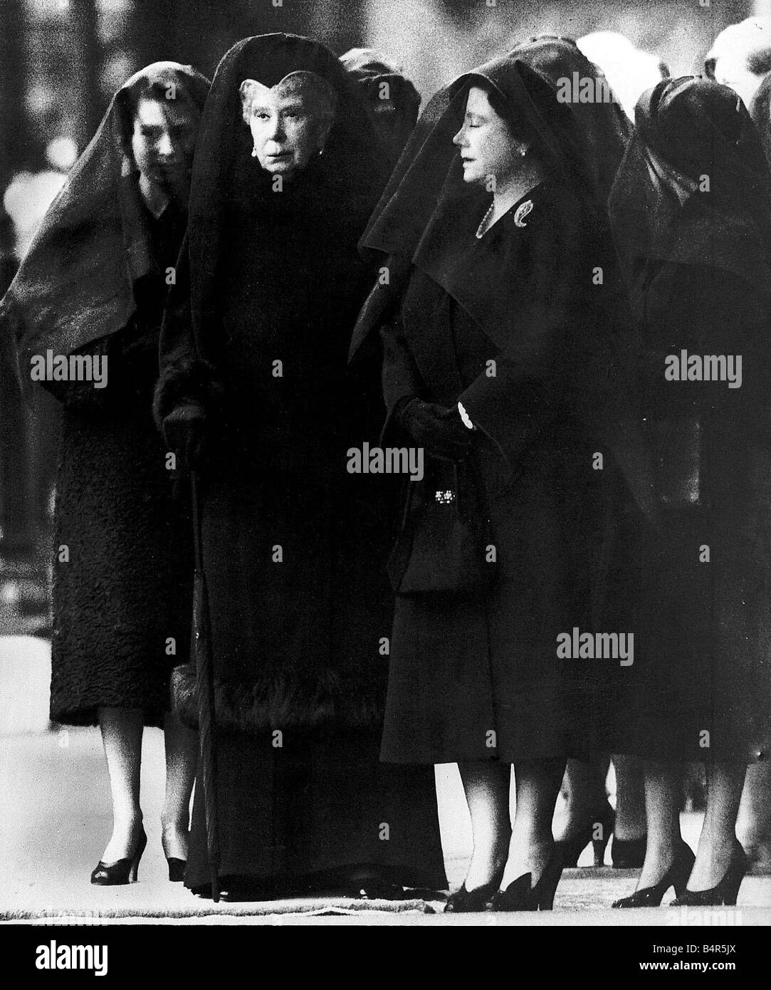 15th February 1952 Three Queens Queen Elizabeth Queen Mary and the Queen Mother watch the body of the King being placed in Westminster Abbey The acsension of Elizabeth came on her father s George VI sad death on February 6th 1953 She was in Kenya at the time so the proclamation was not official until the 8th The three queens were rarely pictured together Unfortunately Queen Mary died on the 24th March 1953 George VI was the third son she had seen die George VI never found being king easy but his popularity was never in doubt It was evidenced by the crowds of people who turned out to pay their Stock Photo