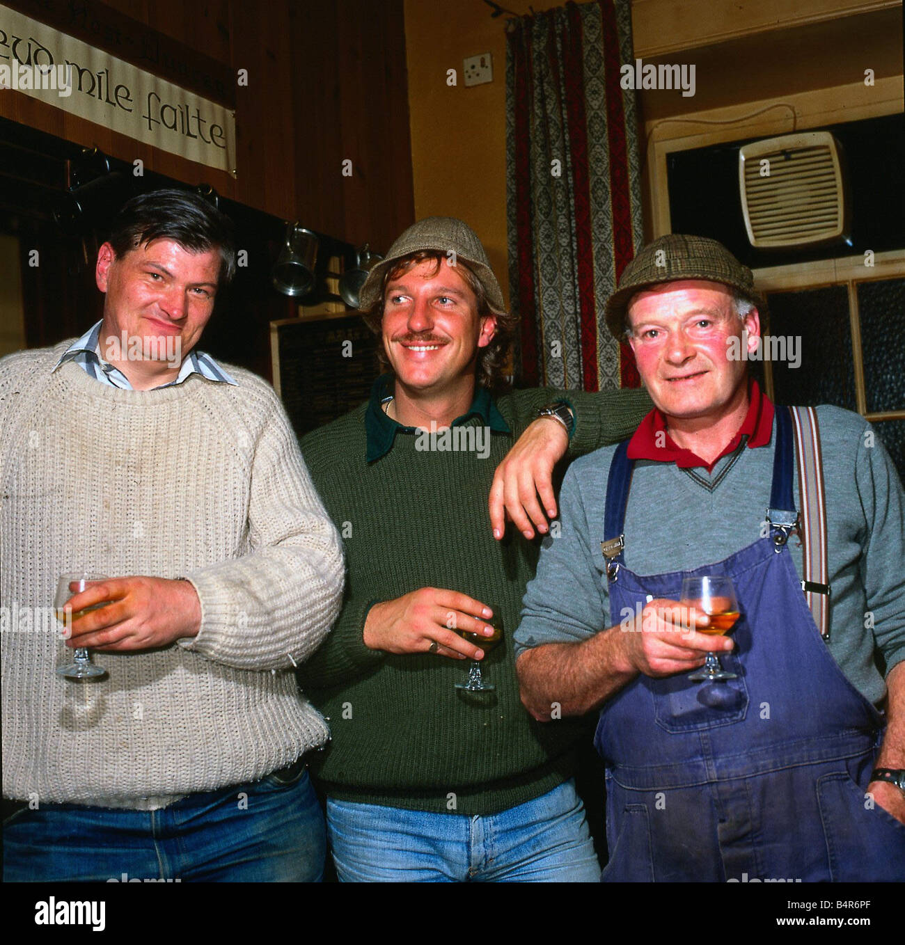 Ian Botham cricketer October 1982 Enjoying drink in pub with locals Stock Photo