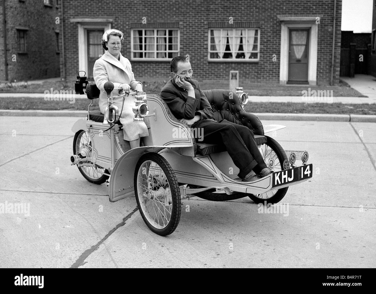 Laurence Mathew driving in his veteran car with his wife sitting in the front May 1956 Stock Photo