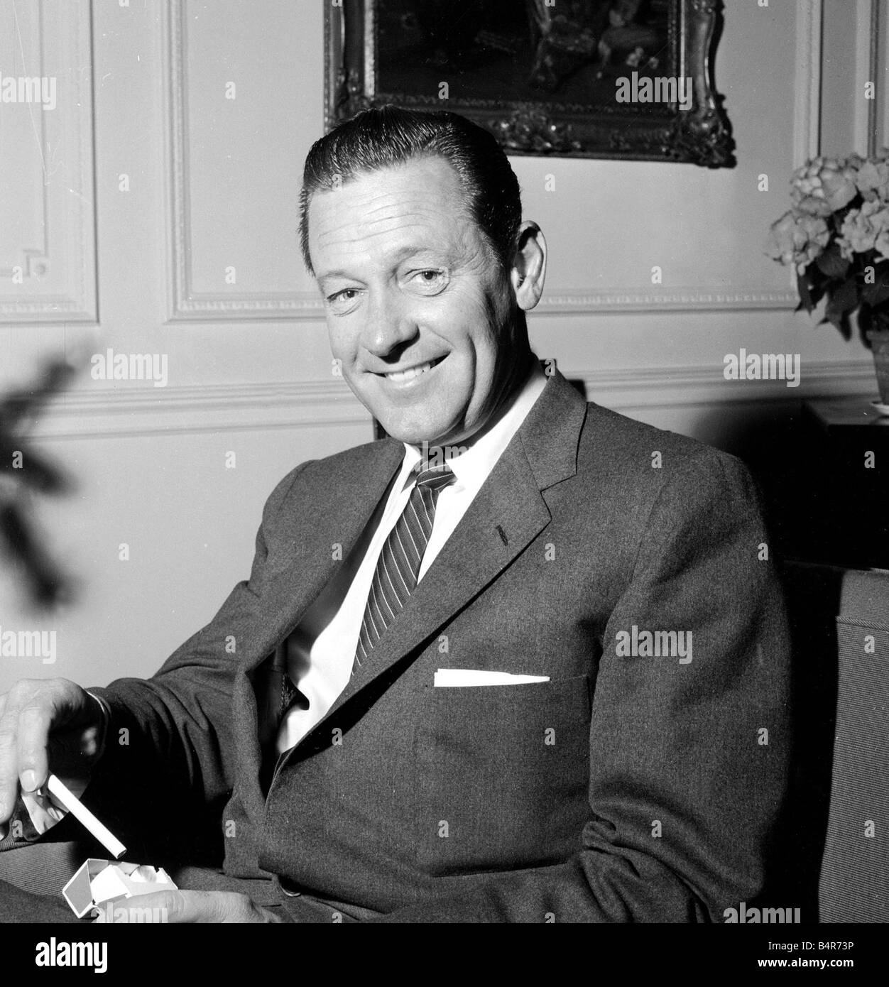 Actor William Holden photographed in his hotel room at the Connaught Hotel while being interviewed May 1957 Stock Photo