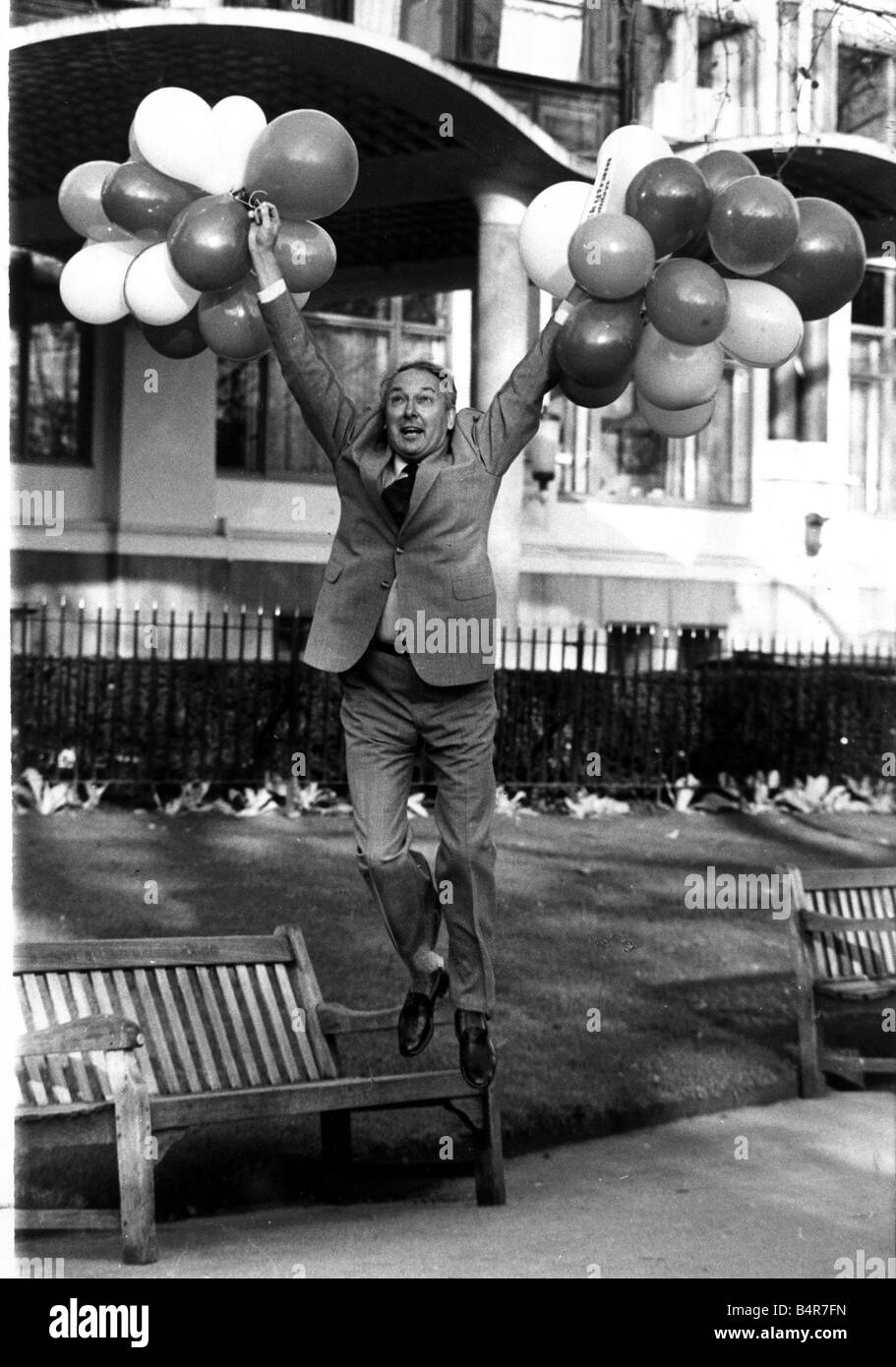 Millionaire airline owner Freddie Laker holding a bunch of balloons after bouncing back into business with new company Skytrain Stock Photo