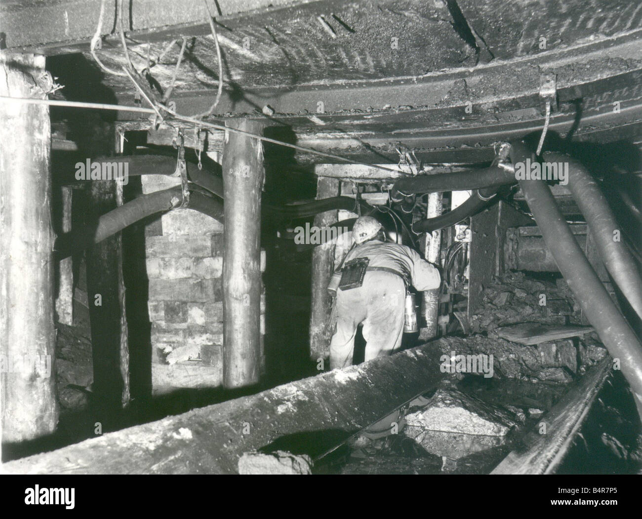 The cramped conditions at Ellington Colliery near the pit s most productive face Pressure had lowered the roof by nearly three feet trapping equipment October 1984 Stock Photo