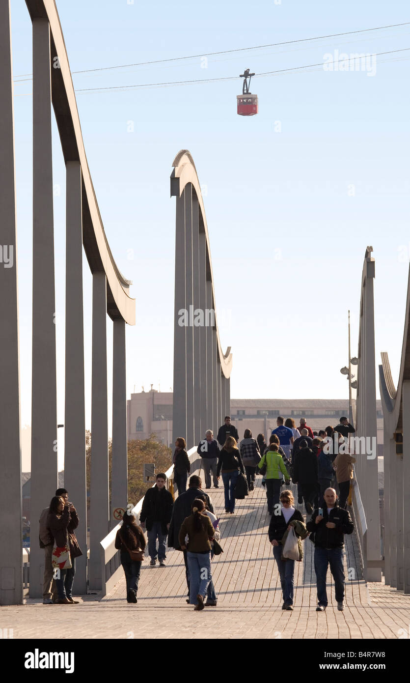 People crossing bridge to Maremagnum, Barcelona Stock Photo