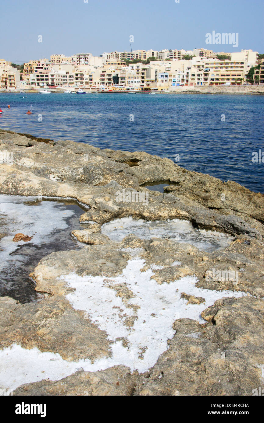 Natural sea salt formed in rocks at Marasaskala in Malta Stock Photo