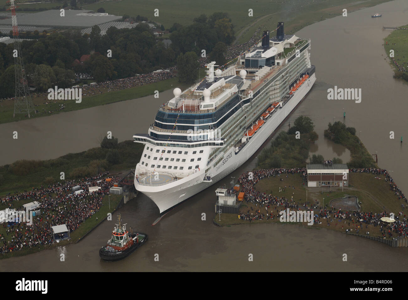 Celebrity Solstice squeezes out of the lock at the Papenburg shipyard where she was built. Stock Photo