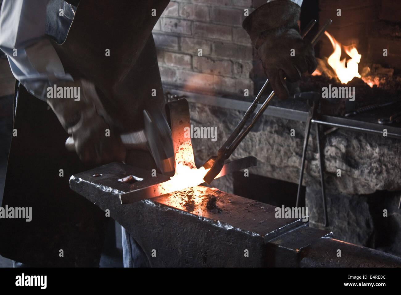 Blacksmith demonstrating his craft to the visitors at Heritage Park in Calgary Alberta Stock Photo