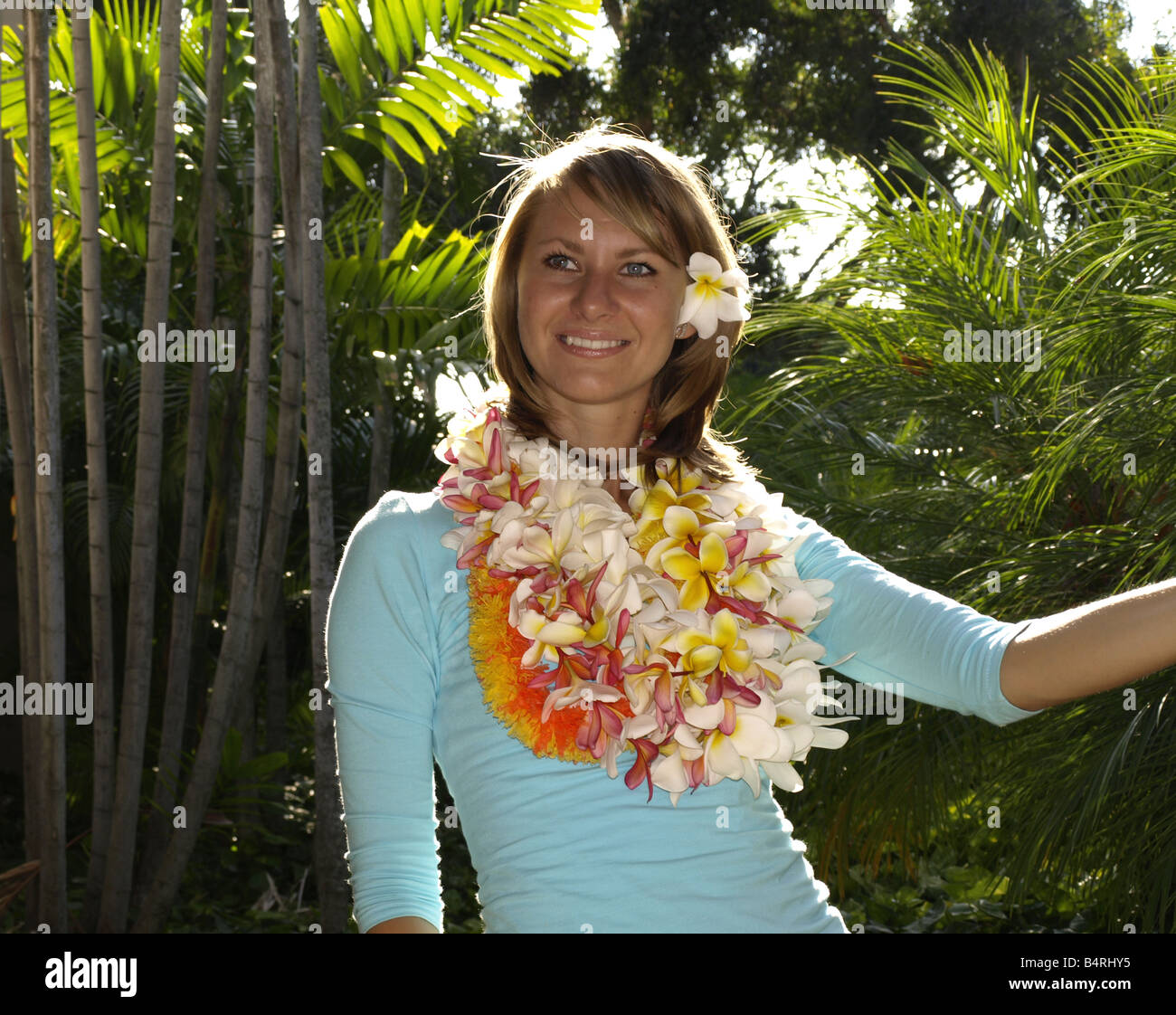 Young woman with leis Stock Photo