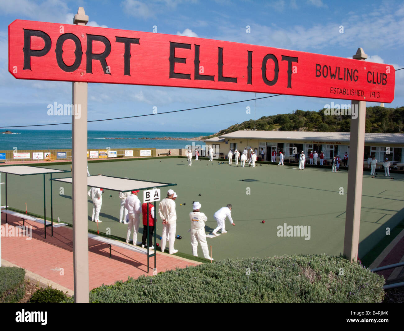 Bowlers dressed in white playing lawn bowls by the sea at Port Elliot in South Australia near Adelaide 2008 Stock Photo