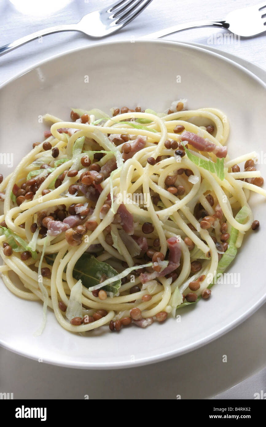 Spaghetti pasta with lentils lettuce and ham Italy Stock Photo Alamy