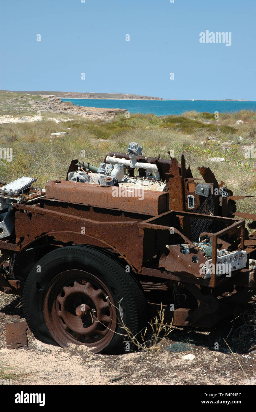 The rusting remains of a military vehicle on Trimouille Island in the Montebello Islands of Western Australia Stock Photo