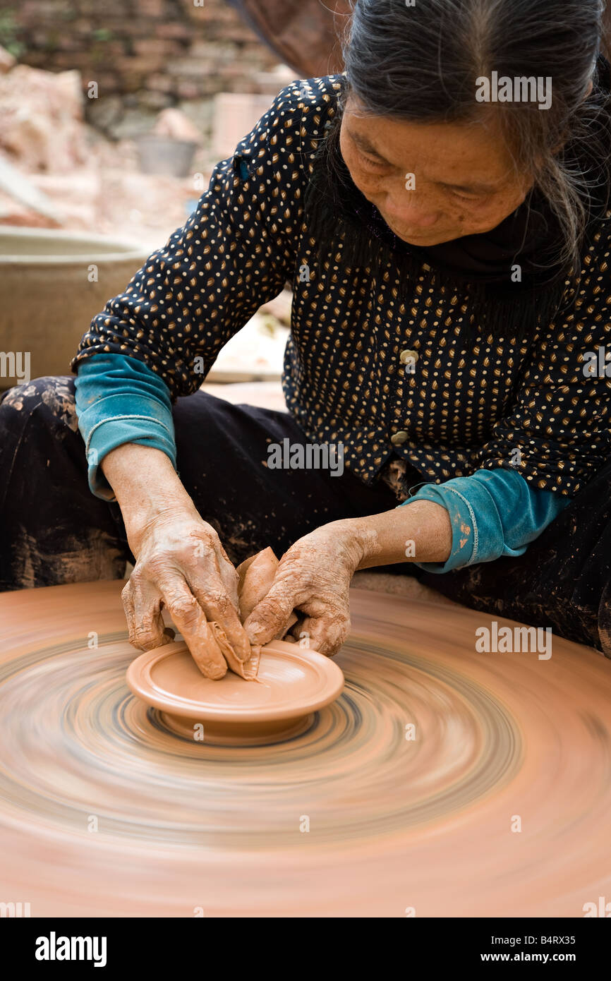 A pottery worker at a factory Stock Photo Alamy