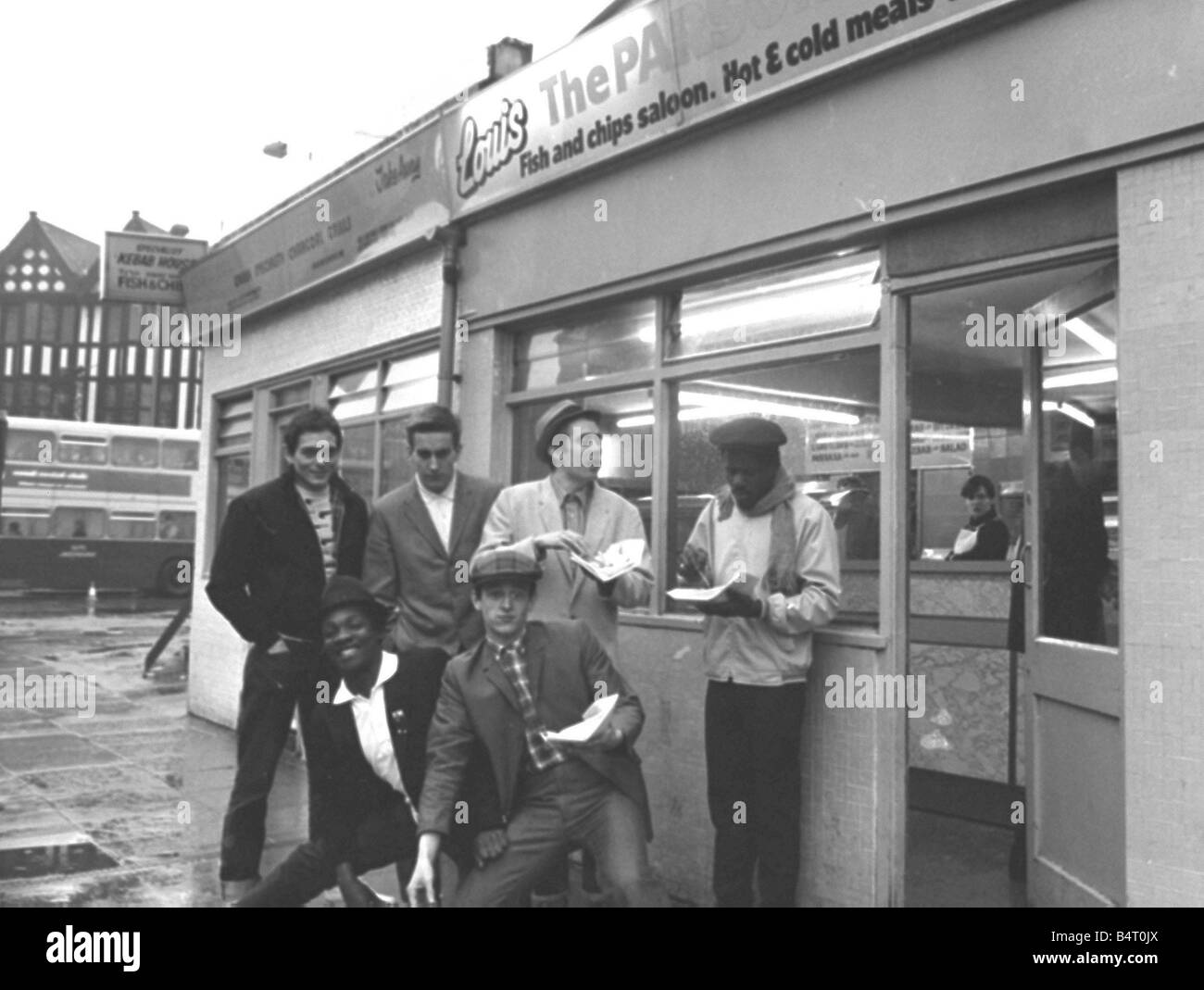 The Specials pop group in chip shop called The Parson s Nose in Street Coventry Stock