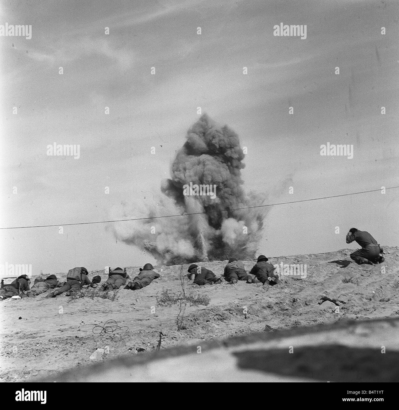 Suez Crisis 1956 Royal Engineers take cover as they blow up a mine from a beach near Port Said which they are clearing Stock Photo