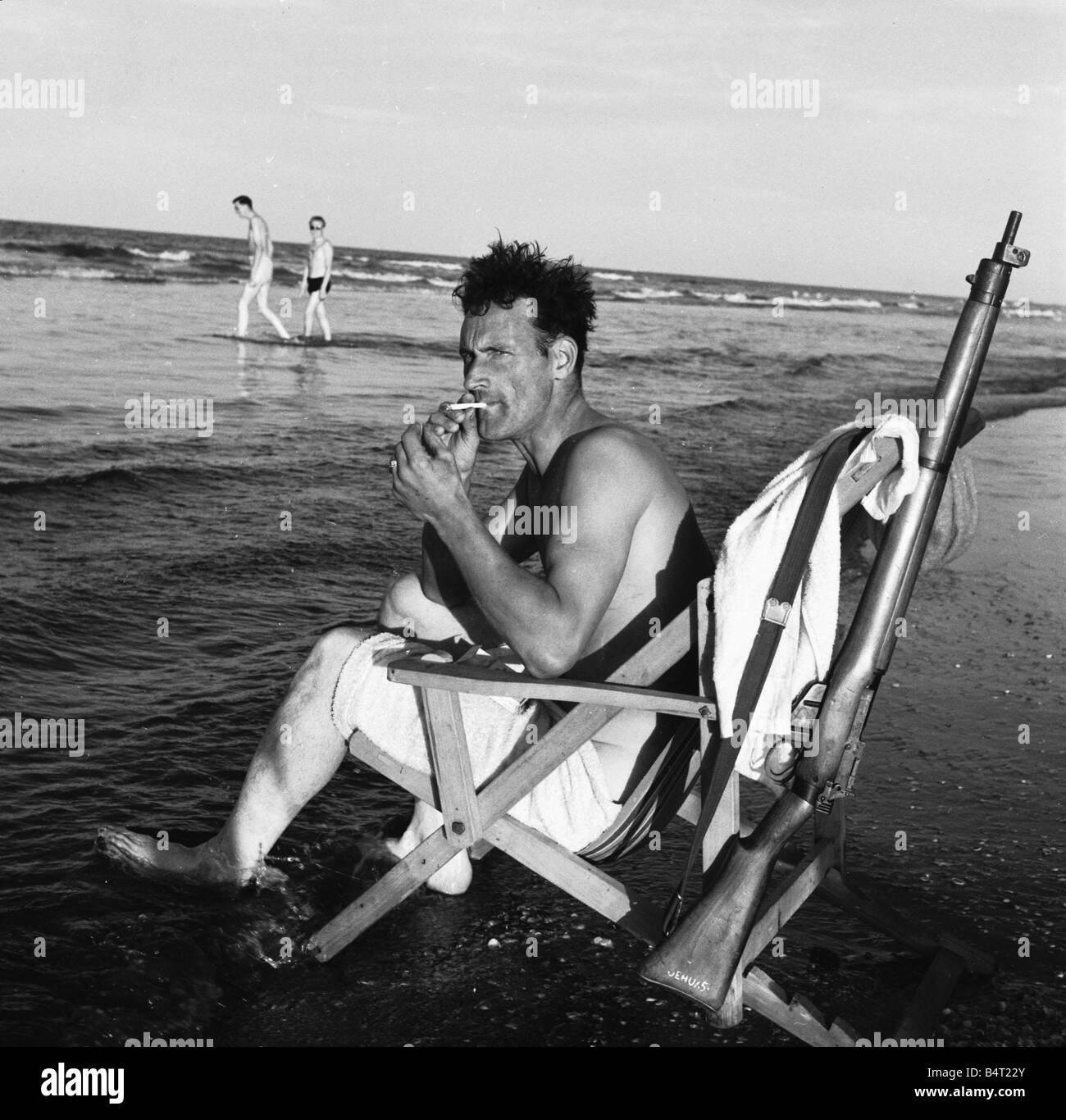 Suez Crisis 1956 Norman Donald of the Pioneer Corps relaxes with a cigarette on the beach near Gamil Stock Photo