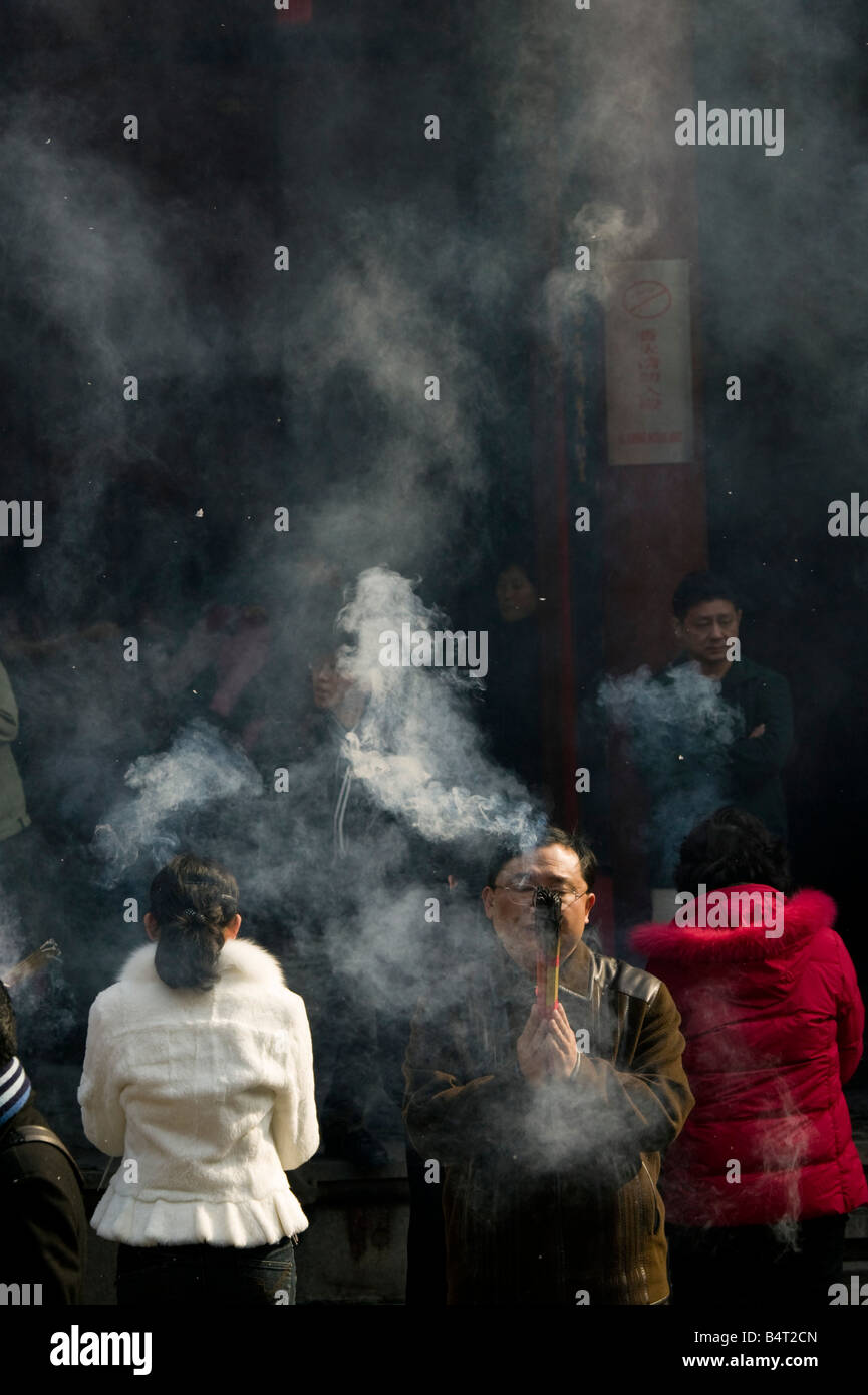 China, Shanghai, Jade Buddha Temple, Prayer Offerings and Incense Stock Photo