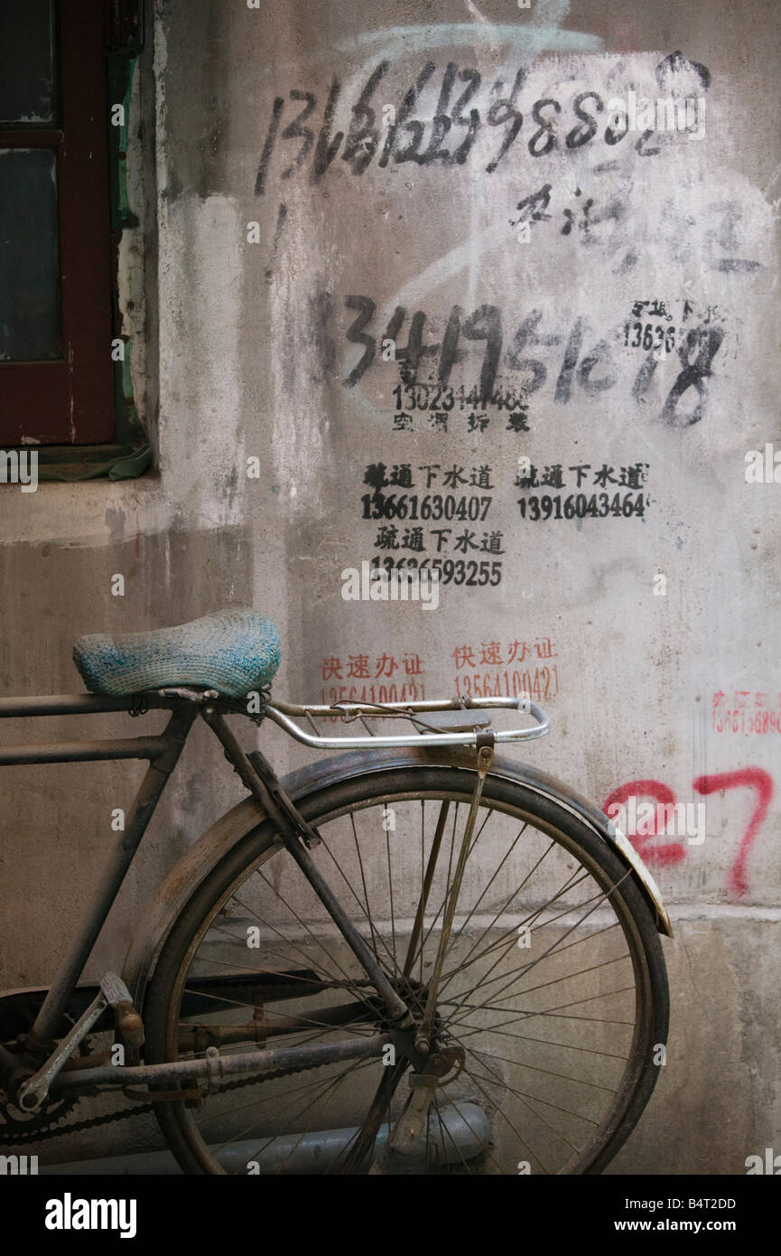 China, Shanghai, French Concession Area, Taikang Road Arts Center, Bicycle and Graffitti Stock Photo