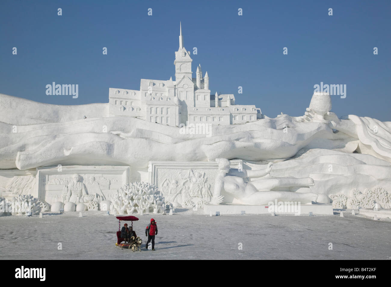 China, Heilongjiang, Harbin, Ice and Snow Festival, Dog Sled Rides by Frozen Sun Island Lake Stock Photo