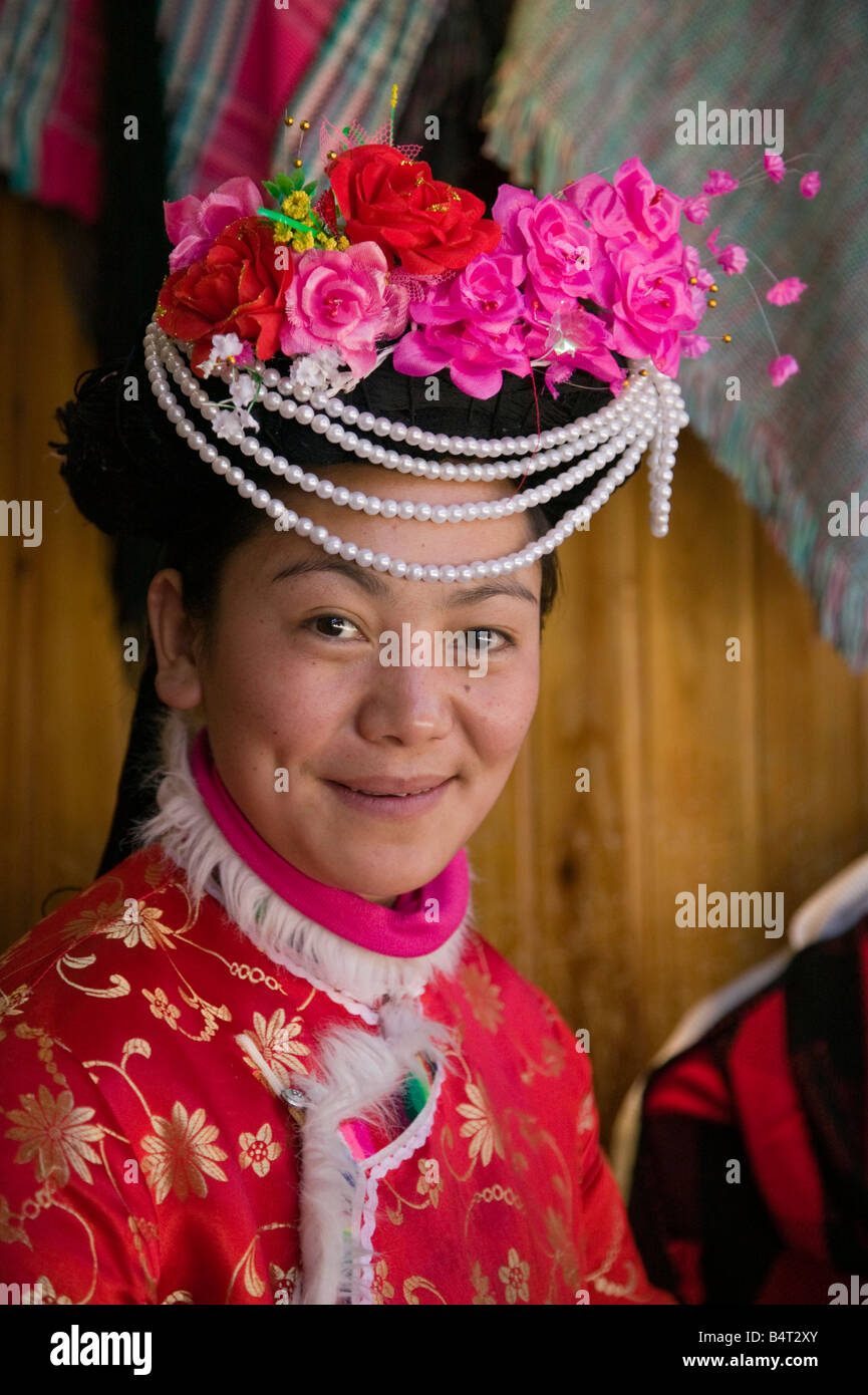China, Yunnan Province, Lijiang, Old Town, Young Woman in Naxi clothes Stock Photo