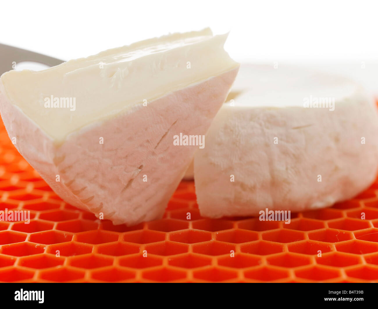 Cutting Goats Cheese Stock Photo Alamy