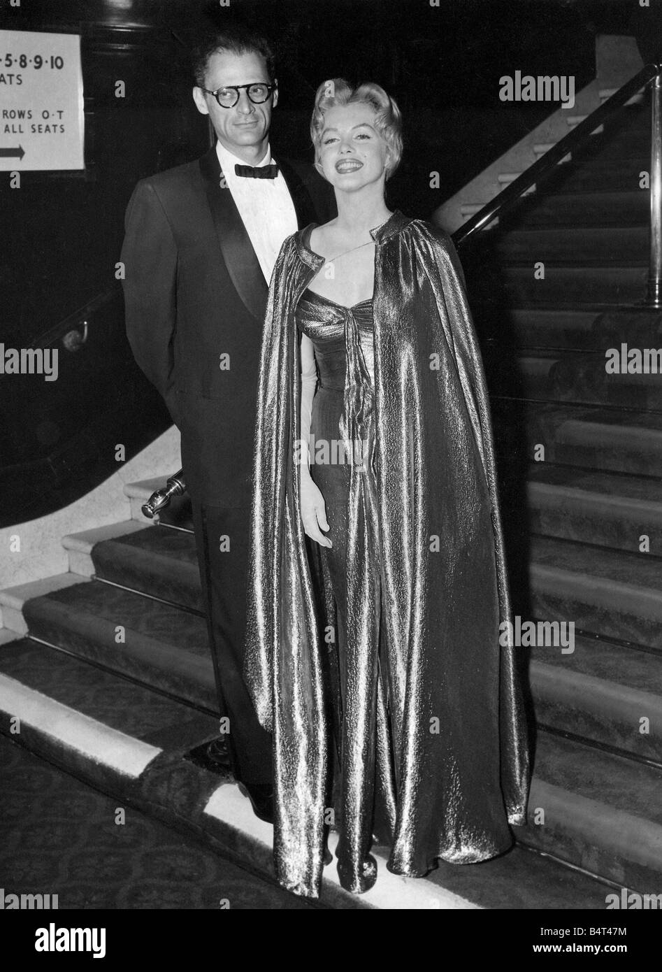 Actress Marilyn Monroe pictured with her playwright husband Arthur Miller arriving at the Empire Theatre Leicester Square for the Royal Film Performance of the British film The Battle of the River Plate 29 10 56 Stock Photo