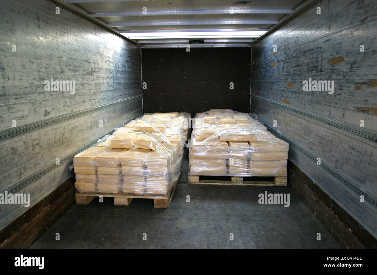 manufactured cheese on pallets in back of refrigerated truck Stock Photo