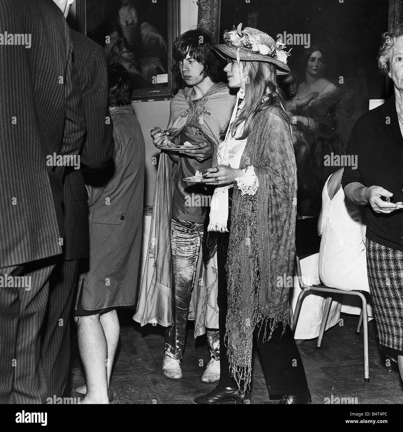 Mick Jagger and Marianne Faithful seen here during a weekend trip to Dublin While there they dropped in apparentley uninvited at the Butler Society Dinner held in Kilkenny Castle August 1967 The pair dressed in full hippie garb clearly didn t fit in and after grabbing a bite to eat made a hurried exit Stock Photo