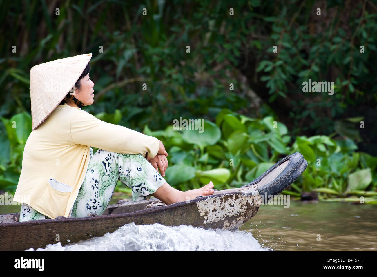 A lady on her wooden canoe at floating market Stock Photo Alamy