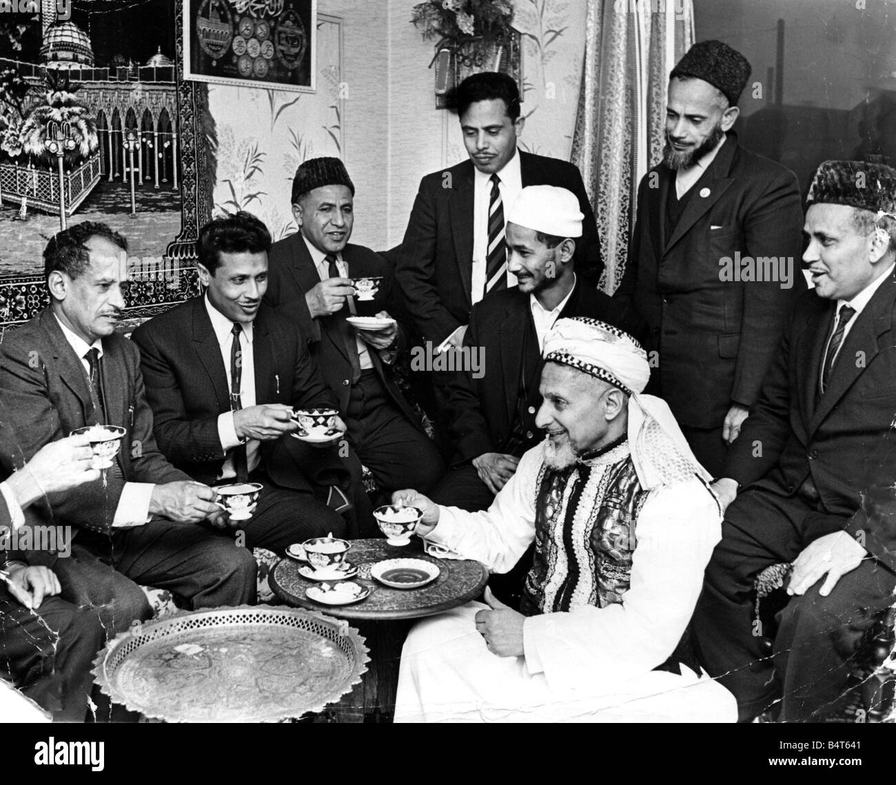 Moslems gather together at Loudon Square Cardiff before the feast of Ramadan Left to Right Amhed Hassan MohamedYafiy Hagid Mammon Mohamed Abdul Abdul Mishegeri Mohamed Ali and Mohamed Mthar In the front in national costume is Hag Salah December 1969 Stock Photo