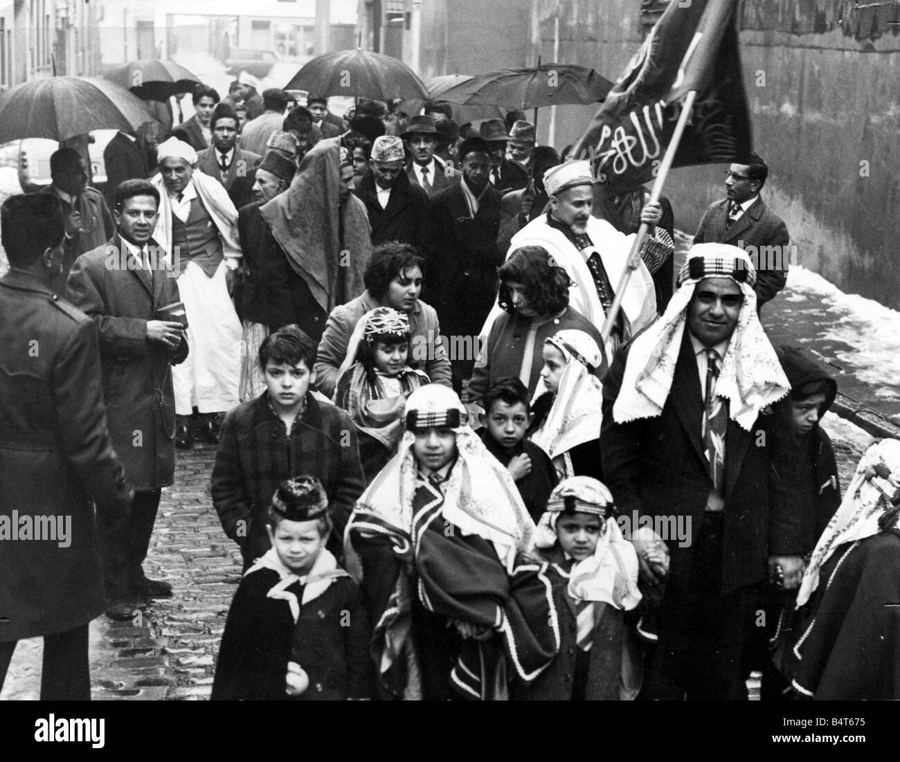 Moslems form a procession in Gladstone Street before marching down Bute Street to celebrate the end of a month of fasting The were celebrating the end of Ramadan 22nd January 1966 Stock Photo