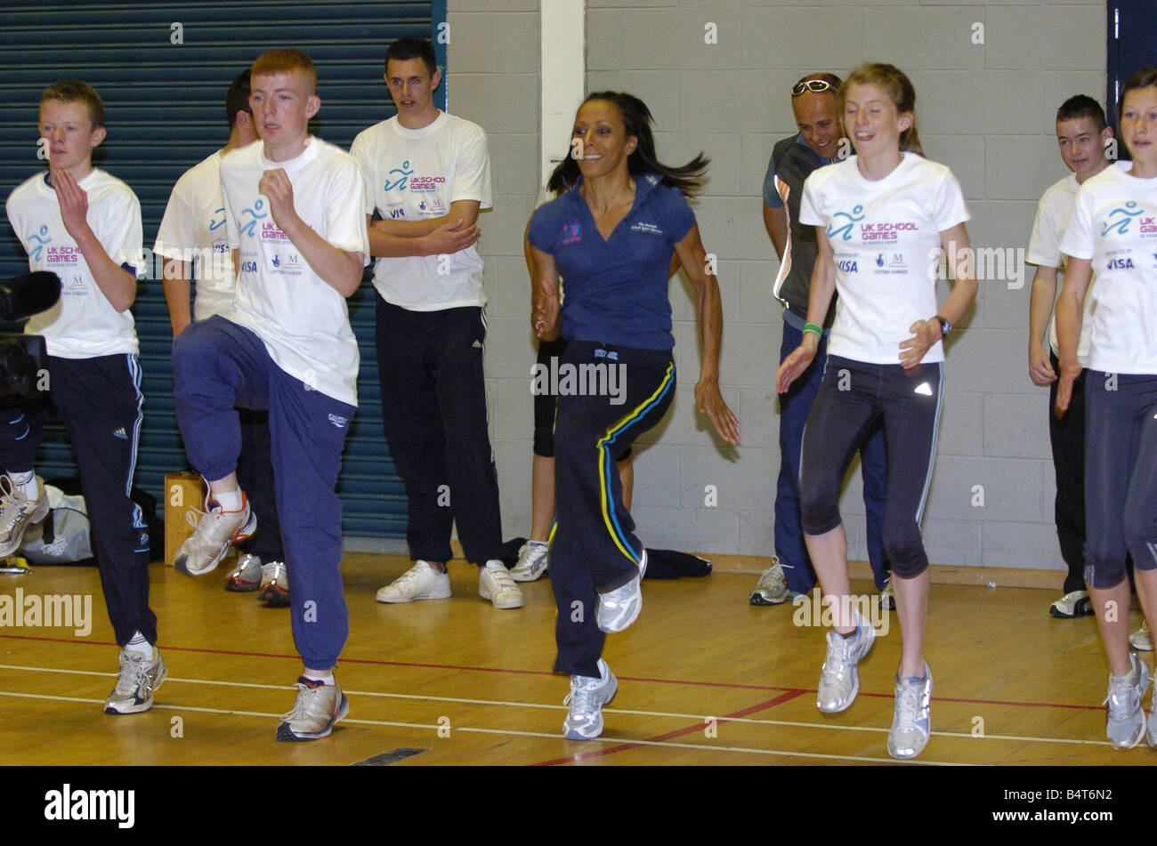 Dame Kelly Holmes with fencers Fiona Winchester and Michael Clarke promoting the forthcoming uk schools games competition Dame kelly was at scotstoun showground giving advice to kids in the sports of table tennis athletics etc Stock Photo