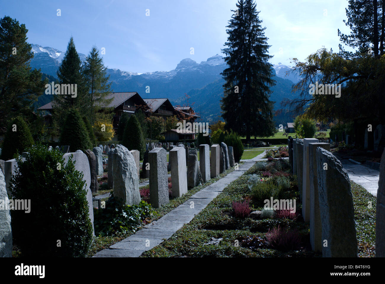 Peaceful cemetary with the Alps in the background Stock Photo