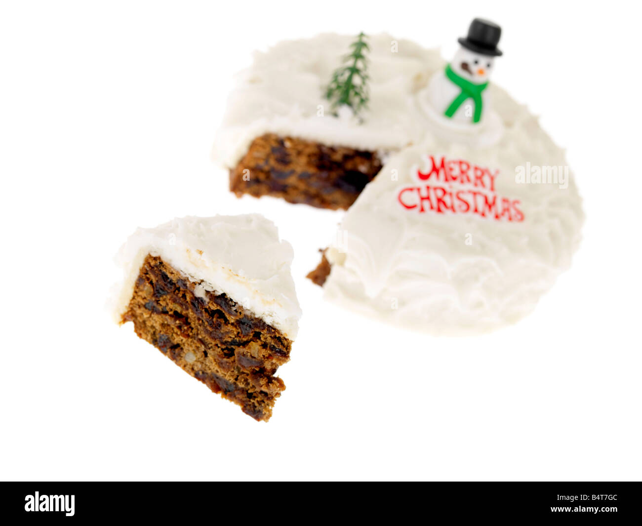 Fresh Festive Rich Fruit Decorated And Iced Christmas Cake Isolated White Background With No People and A Clipping Path Stock Photo
