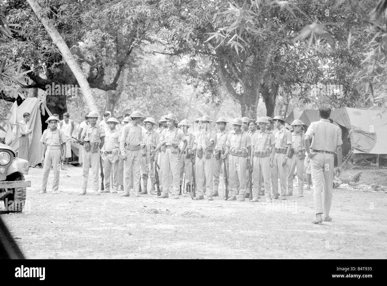 Pakistan - Bangladesh Civil War June 1971;A large area of East Pakistan territory is under the control of the Bangladesh Freedom Fighters. These pictures were taken on patrol with an operational unit whose camp is in the Jungle just inside the Indian border.;Our Picture Shows: Troops in camp preparing to go out on operations Stock Photo