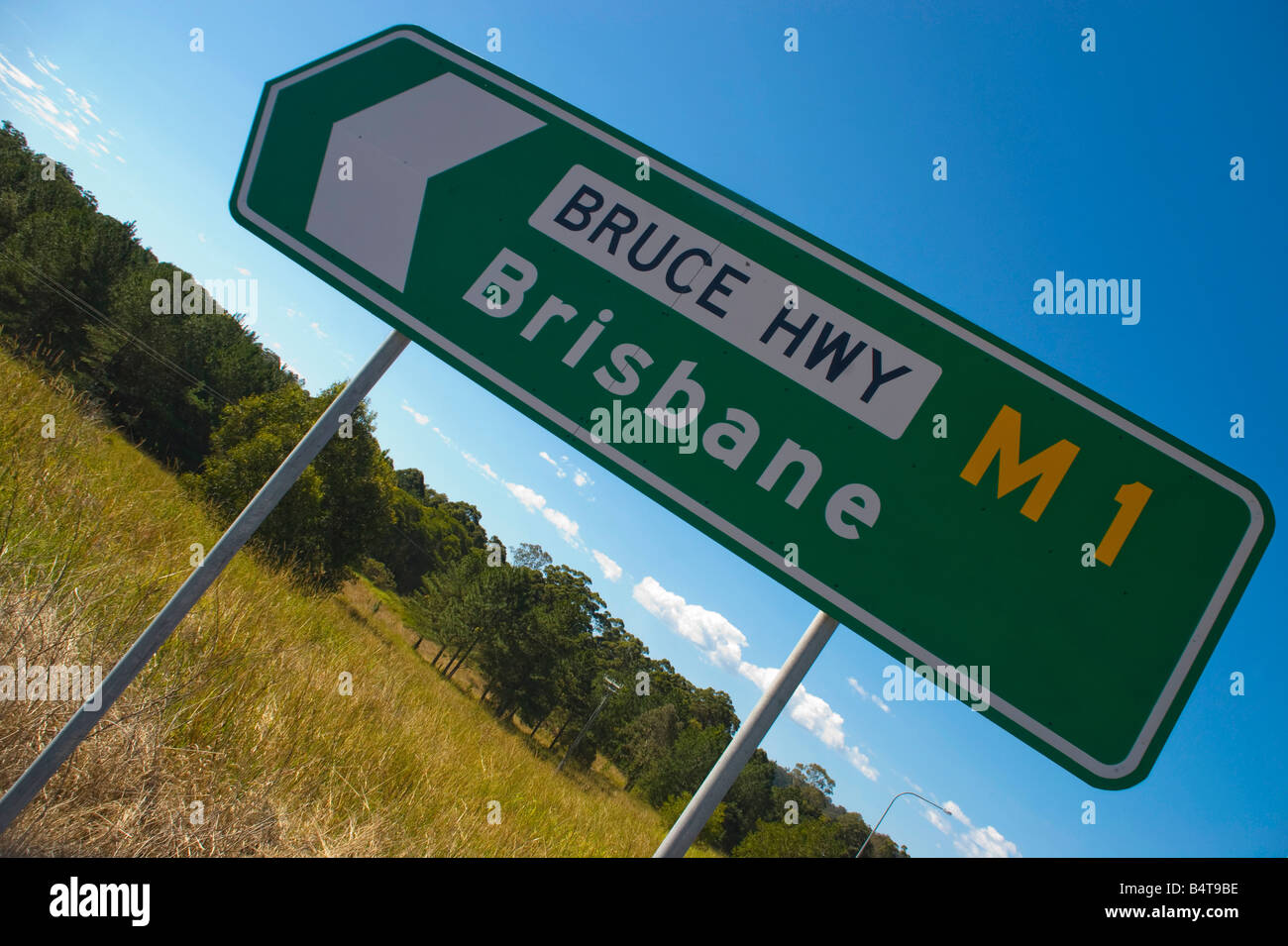 Highway sign pointing to the city of Brisbane on the Bruce Highway in Queensland Stock Photo