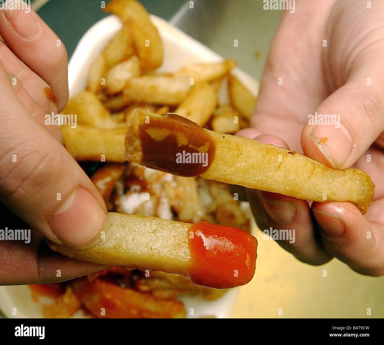 Chips brown sauce and ketchup Stock Photo Alamy