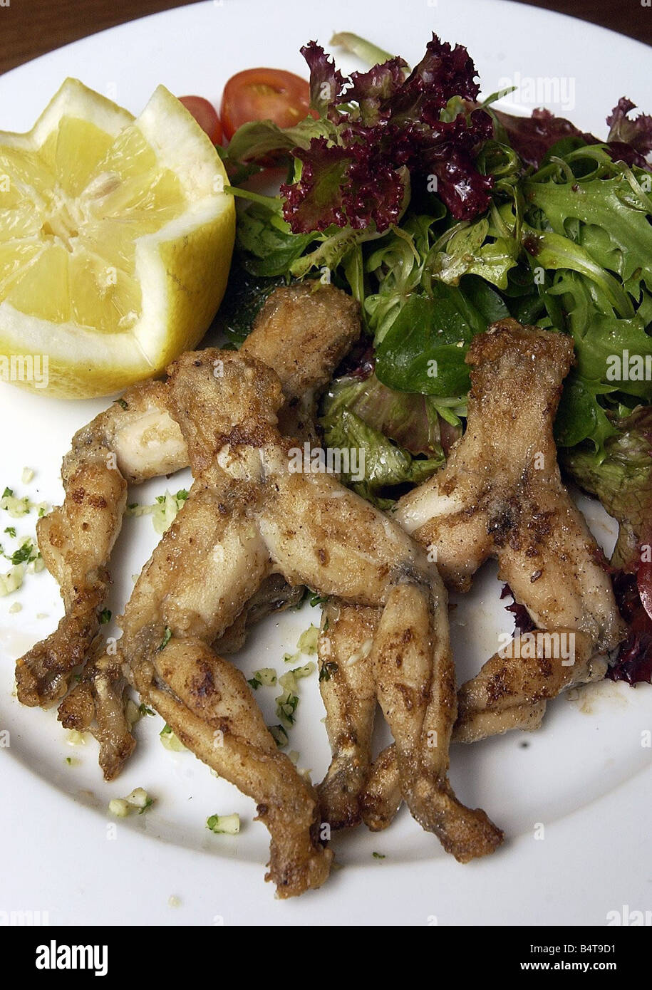 A Dish Of Frog Legs Stock Photo Alamy