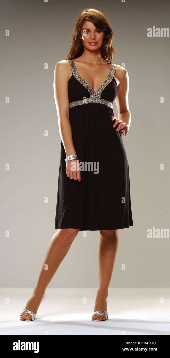 Fashion dresses MODEL ELI MAXWELL black dress with silver trim Stock Photo  - Alamy