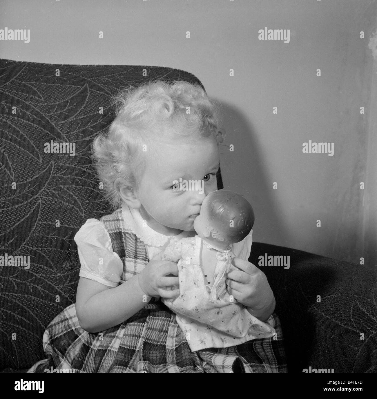 a-small-girl-plays-with-her-doll-circa-1957-stock-photo-alamy