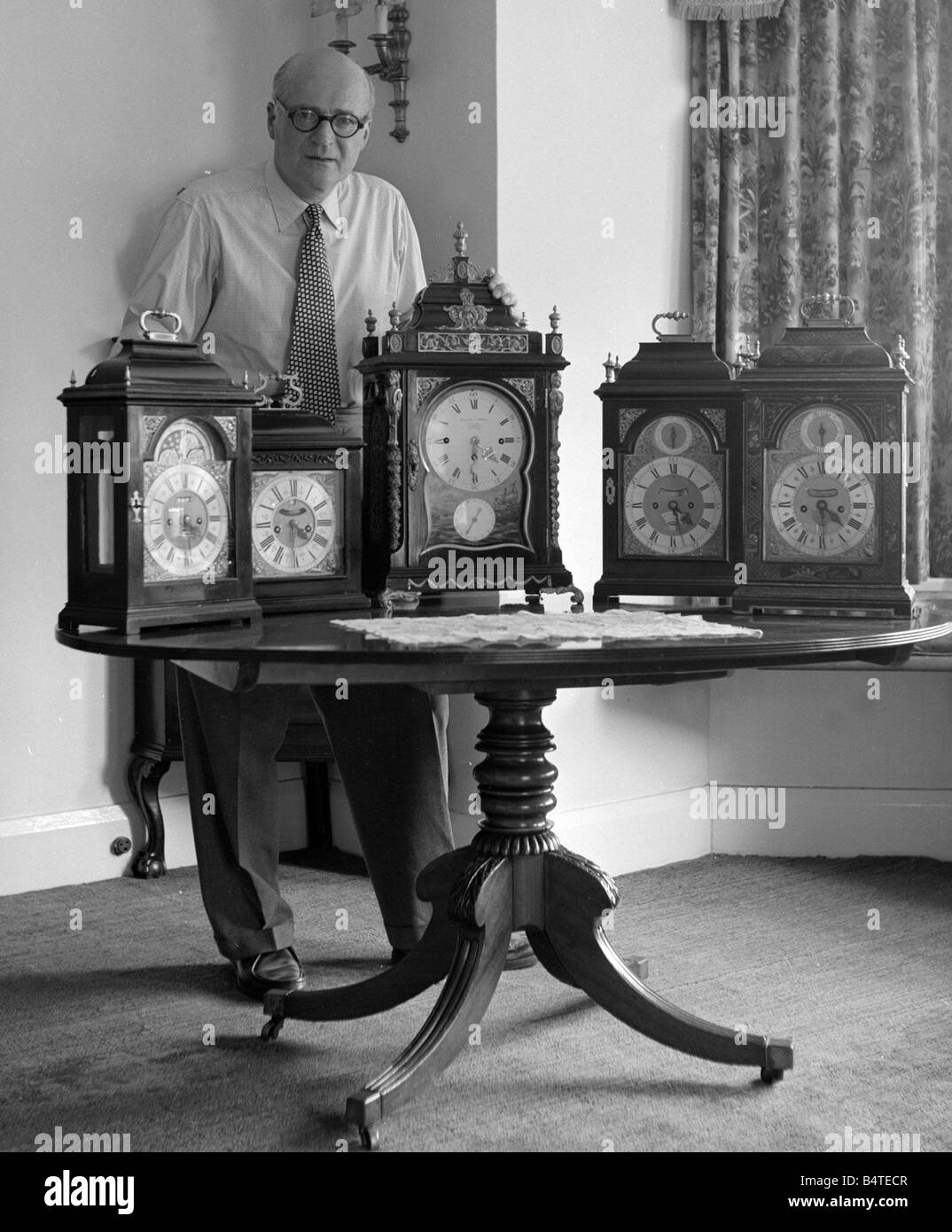 Peter Yorke orchestra leader seen here with a collection of clock June 1957 Stock Photo Alamy