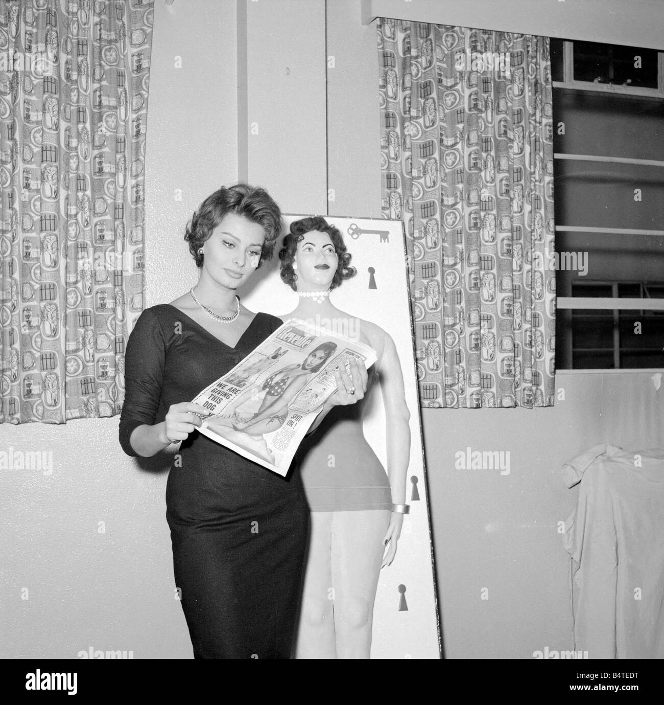 Actress Sophie Loren seen here standing beside a life size cake of her self Circa 1962 Stock Photo