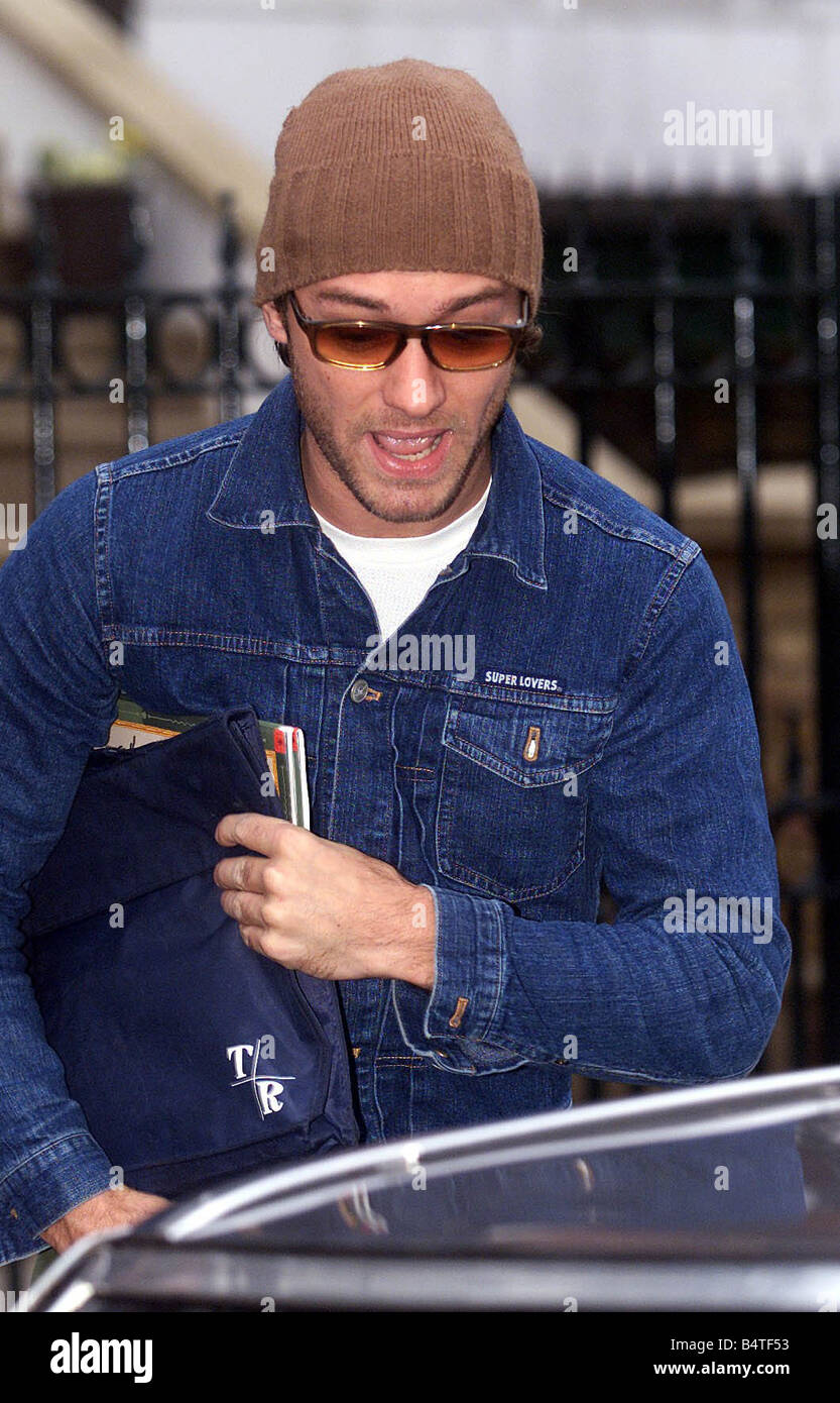 Actor Jude Law leaving his home today a wooly beanie February 2003 Stock Photo -