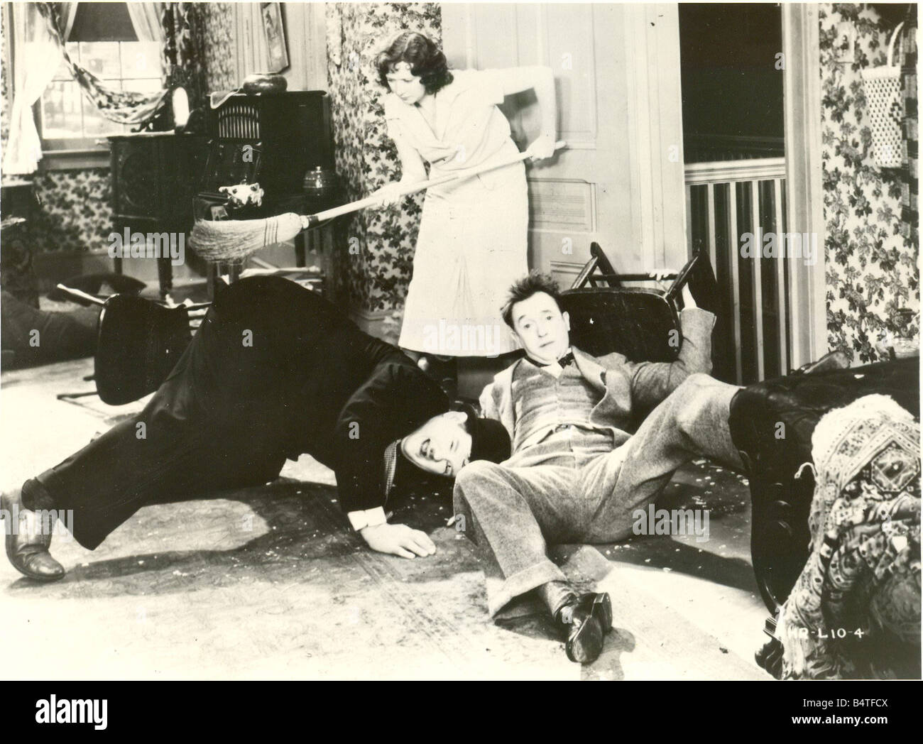 Laurel Hardy Comedy duo Stan Laurel and Oliver Hardy in scene from Their First Mistake film with Mae Busch Stock Photo
