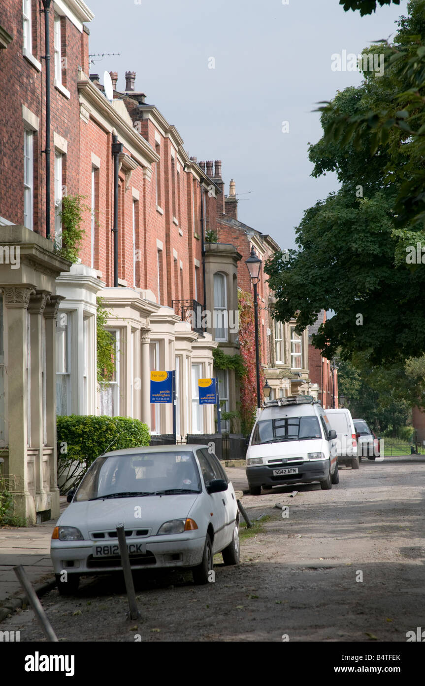 terraced row of run down old victorian urban villas houses homes on Bank Parade Preston