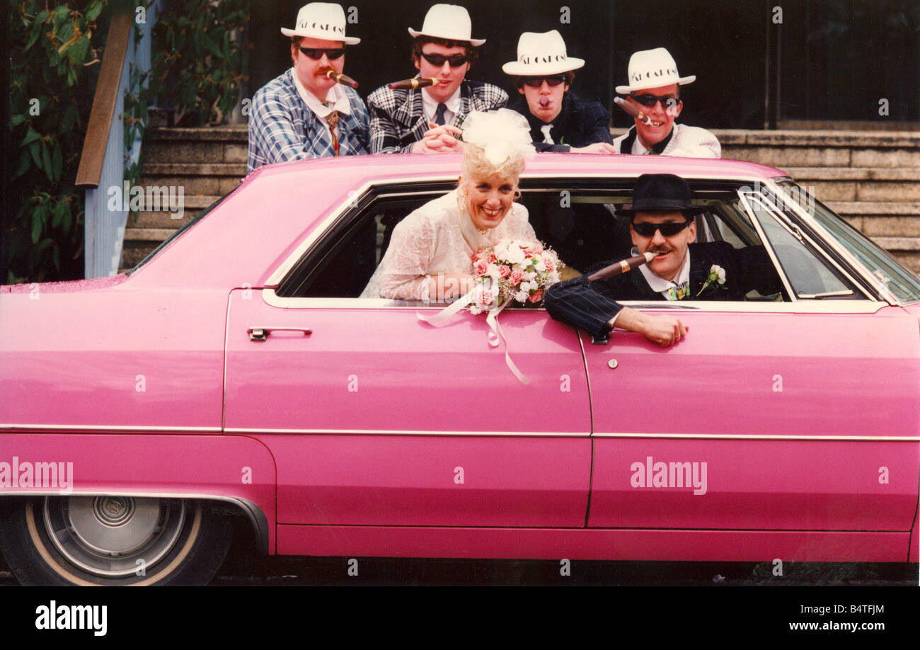 Gangsters and a pink cadillac for a St Valentine wedding at the Civic Centre Bride and groom are David Clark and Pat Hughes with bridal group from left Duncan McKenzie James Harrison Paul Clark and Alan Hill Stock Photo